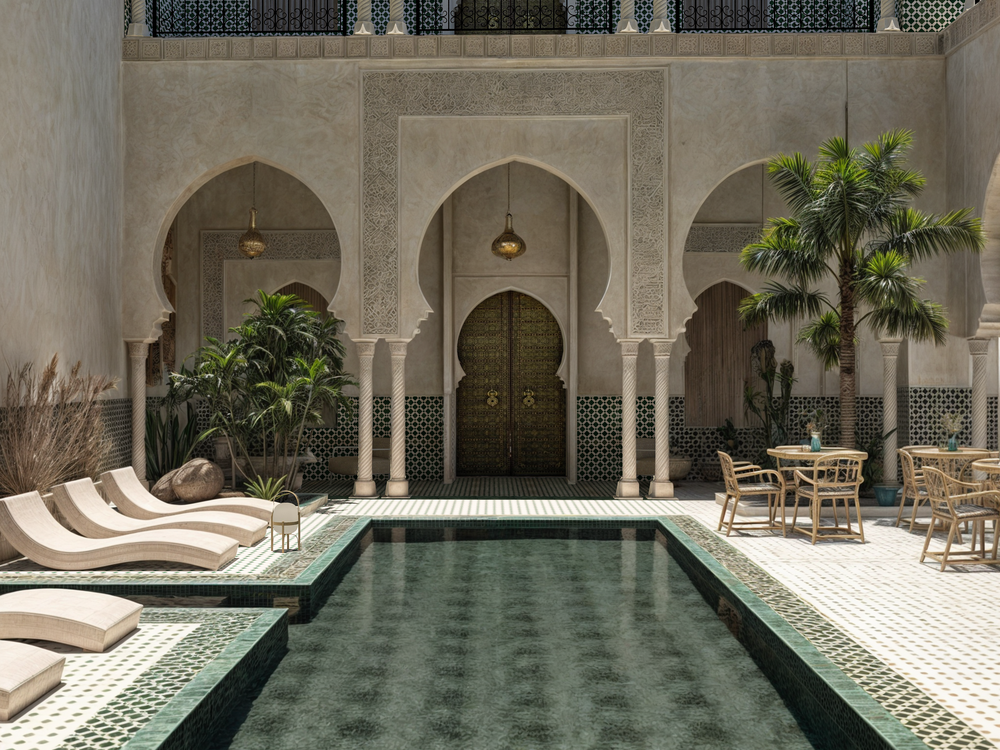 The lantern-lit courtyard and pool at night