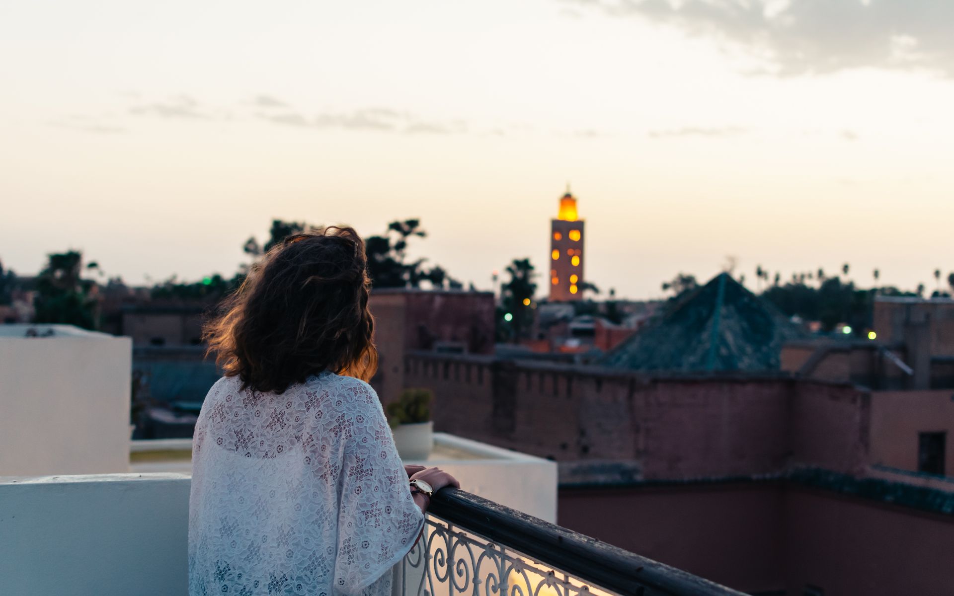 The rooftop terrace at sunset over the Marrakesh medina