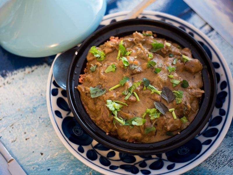 Tagines served on a candlelit table